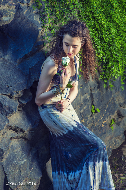 Girl talking to flower