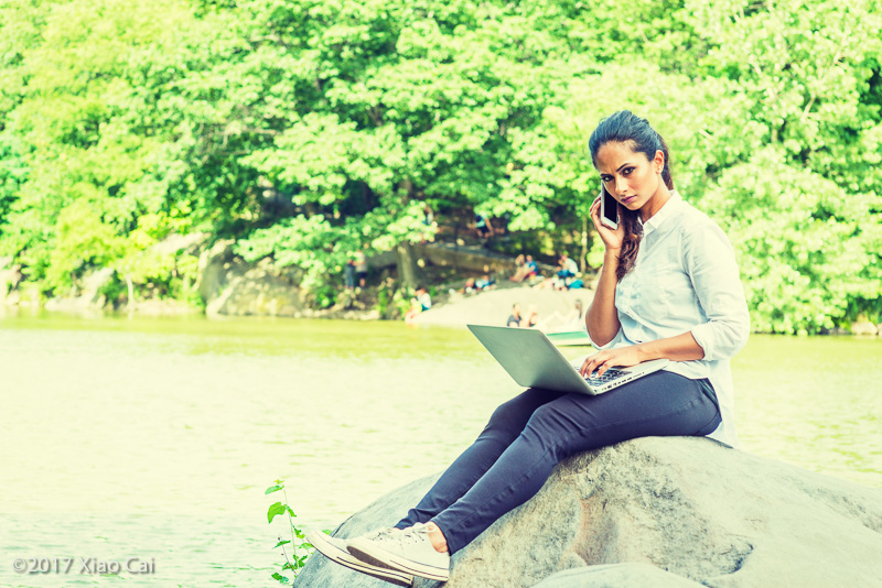 Young East Indian American Woman Working Outdoor in New York
