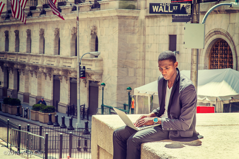 Young Man Working on Street